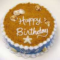 Beach Birthday Lemon cake with lemon cream cheese frosting. Shells are white chocolate.