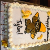 Curious George Birthday Chocolate cake with vanilla buttercream frosting. George is a FBCT. Bananas are fondant that I painted. I was disappointed in my writing on...