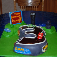 Lightning Mcqueen - Cars Cake - 3Rd Birthday Party I made this for my son's 3rd Birthday party. The racetrack is made from 2, 2 layer circle cakes covered with marshmallow fondant....
