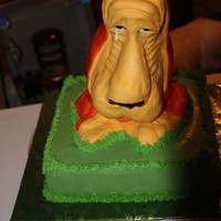 Dog Bank Cake The dog is rice krispy treats using modeling chocolate and ganache to coat before covering in fondant.