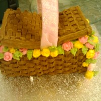 Easter Basket made this in class as part of our examination for the first somester. Its a maderia cake with basket weave and hand piped roses and leaves...