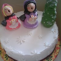 Carol Singers This is a cake that i had to do for cake class, we could do any design but i chose victorian carol singers with a christmas tree. The cake...