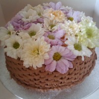 Flower Basket. Piped basket weave on the base of the cake with edible flowers over the top