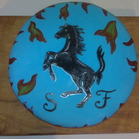 Ferrari Emblem Cake My son wanted a ferrari cake - I wasn't that good yet, but made up for it by giving him the emblem. :)