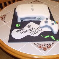 Xbox 360 Cake Fondant covered yellow cake with buttercream frosting. XBox Controller made with RKT and covered with Fondant.