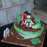 Spiral Bicycle Cake This was done for a 40th birthday of an avid bike rider. The cake is covered in MMF and crushed cookies and cake crumbs that were leftover...