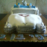 Ecto 1 Ghostbusters Cake All edible except for the wire. Uses Satin Ice MMF. Silver petal dust and gel colors.