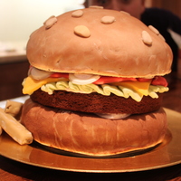 Burger And Chips My first attempt at a fully decorated/iced cake...Very Impressed.The top bun is made out of chocolate and Vanilla marble cake filled with...