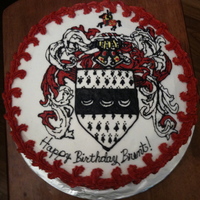 Family Crest Birthday Cake wasc cake with butter cream, crest freehand in butter cream