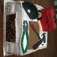 World's Greatest Handy Man Double layer white cake, buttercream icing, all decorations made out of fondant, toolbox is RCT and fondant, goes by Pops to grandkids so...