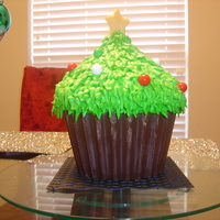 Giant Cupcake Christmas Tree Cake chocolate cake with cream cheese icing. I made a chocolate mold for the cupcake bottom.