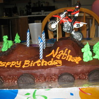 Dirt Bike Cake Chocolate cake, oreo cream cheese filling, dark chocolate butter cream! Extra rich but tasty!