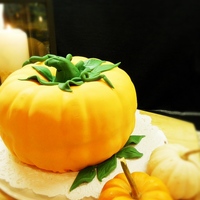 Pumpkin Cake This life size pumpkin cake was made from two bundt cakes put together. Pumpkin spice and french vanilla cake layers covered in fondant