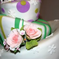 Birthday Cake three tiered topsy turvy purple and green cakeand edible flowers...
