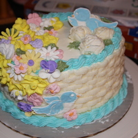 My First Basket Weave Cake I made this in my Wilton class. The basket weave was easier than I thought, but some of those flowers were really hard! The bluebird is...