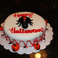 Halloween Cake I made the black widow spider out of fondant and the pumpkins and eyeballs as well. I watered down and colored piping gel to make it look...