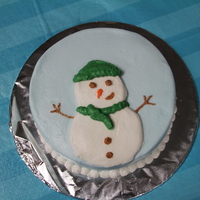 Snowman Chocolate chip cookie cake with oreo filling and vanilla buttercream.