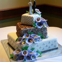 Calla Lily Wedding Cake This cake was vanilla pound cake with strawberry buttercream on the top and bottom tiers and double chocolate in the middle tier. The cake...