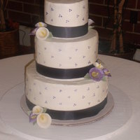 Violet_Taylor's Cake Butter cream three-tier w/gum paste calla lilies. This is my very first wedding cake and the first time working with gum paste and luster...
