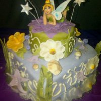 Tinkerbell Cake Tiered Tinker Bell Cake with custom made edible fondant tinkerbell and scenery.