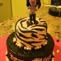 Monster High Tiered Cake Tiered fondant cake with edible custom fondant topper modeled after Clawdeen Wolf from Monster High.