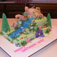 Abbys Tinker Bell Garden Choc fairy garden cake with tinker bell on sunken fondant teapot