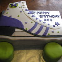 Roller Skate Cake Chocolate cake with a vanilla IMBC, Wheels were Carrot Cake with a cream cheese IMBC. Covered in MMF.
