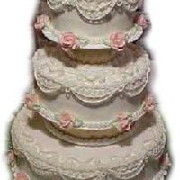 May Wedding This cake featured scroll work, string work, and English over piping. All icing and decoration was done in buttrcream.