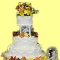 Fall Wedding This cake features the basket weave technique, scallops, and fluer de lis. Natural flowers were used.