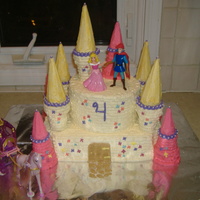Jordan's Castle Vanilla cake with buttercream icing and ice cream cones for the towers. Characters were provided by the mom who ordered the cake.
