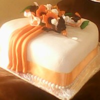 Orange And Brown Wedding Cake Iced and decorated with plastic icing