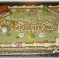 Baby Shower With Fondant Items carrot cake, cream cheese icing. fondant pacifier, rattle, diaper, bronzed shoe