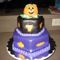 Happy Halloween I am new to cake decorating and thought I'd try fondant cut out's. All of this cake is edible. Enjoy!!