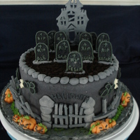 Halloween 2010 This is a 2 layer white cake, each layer colored orange and purple. BC frosting and covered with MMF. House pattern from Wilton page, and...