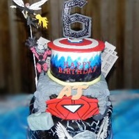 Avenger's Superhero Cake For a big superhero fan, my nephew. The bottom tier is for Thor, hand-painted lightning strikes with white edible paint, free-hand fondant...