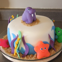 Baby Sea Creatures Shower Cake This was for a friend's baby shower. The theme is under the sea or baby sea animals. We bought bath toys for the accents to save time...