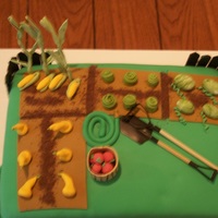 Papa's Vegetable Garden applesauce spice cake with caramel BC and fondant with gumpaste vegetables and fence post