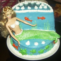 Mermaid Cake This was my first time working with gum paste. I used it for the tail, but found that it dried too fast. I added a little bit of fondant to...