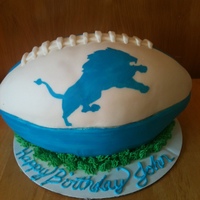 Detroit Lions Football CARVED CREAM CHEESE POUND CAKE COVERED IN MMF, PAINTED LION WITH COLORING GEL.
