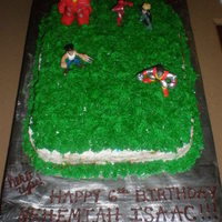 Super Hero Battle In Grass Cake My son's 6th birthday cake. Super hero's power up in the grass!