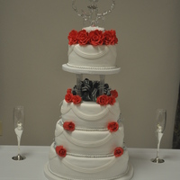 Rose Wedding Cake !!! My first wedding cake ever !! I made it for my mom she loves red roses... the roses are gumpaste, the cakes are 2 lemon , 1 french vanilla...