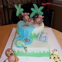 Animal Cake For a 1 and 3 year old birthday party. Animal Themed. Animals are gumpaste, and trees are chocolate