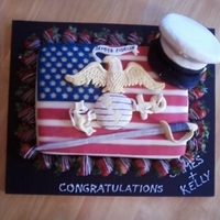 Marine Cake This was a cake I did for a Marine who was getting married. The decorations are gumpaste, and I used RKT for the structure of the hat....