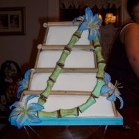 Bamboo Wedding Cake Green bamboo is gumpaste. Brown bamboo and flowers are not edible.