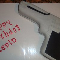 Desert Eagle Gun Cake My very first gun cake, covered in MMF (black fondant is Satin Ice).