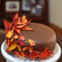 Fall Themed Cake Chocolate cake with peanut butter frosting and chocolate fondant. The leaves are gumpaste, painted with crystal colors brand powdered...