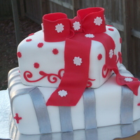 Chirstmas Package Cake A friend of mines asked me to do a Christmas package cake for her job's holiday party. I just winged it and came up with this. 2...