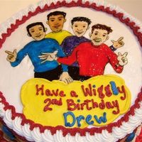 Wiggles Copied drawing on rice paper using non-toxic markers and piping gel. Side decorations- buttercream balloons.