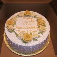 50Th Anniversary Iced and decorated in buttercream. Beads along the bottom border made from candy clay.