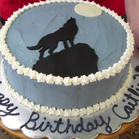 Wolf Silhouette Cake This cake was made for a special 11 year old who loves wolves. BC icing with fondant wolf and moon.